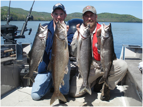 Four big fish caught on River Memphremagog during a fishing day on Memphrémagog Lake